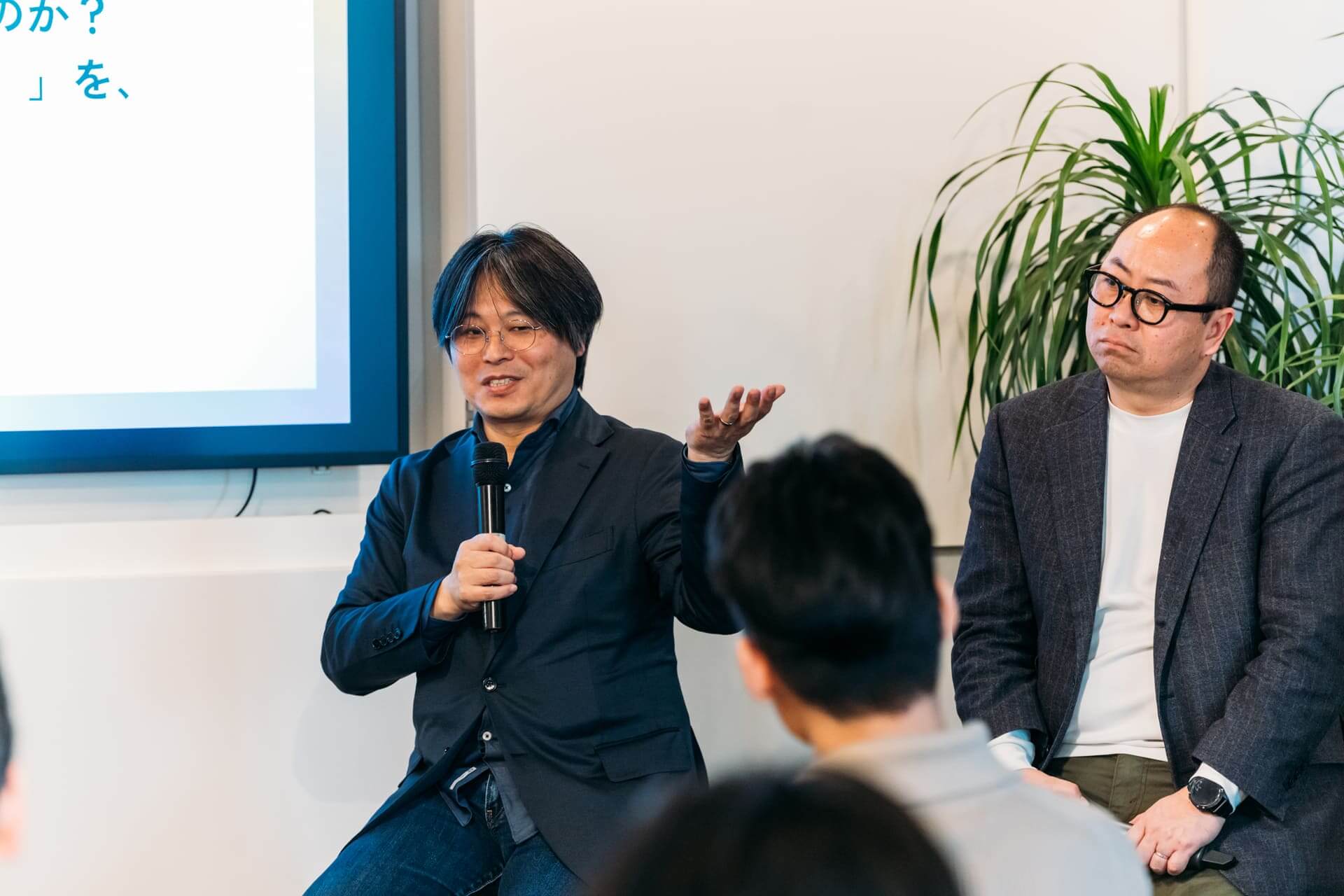 辻本先生が登壇する様子